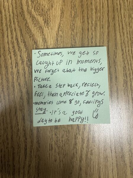 Handwritten sticky note with words of encouragement